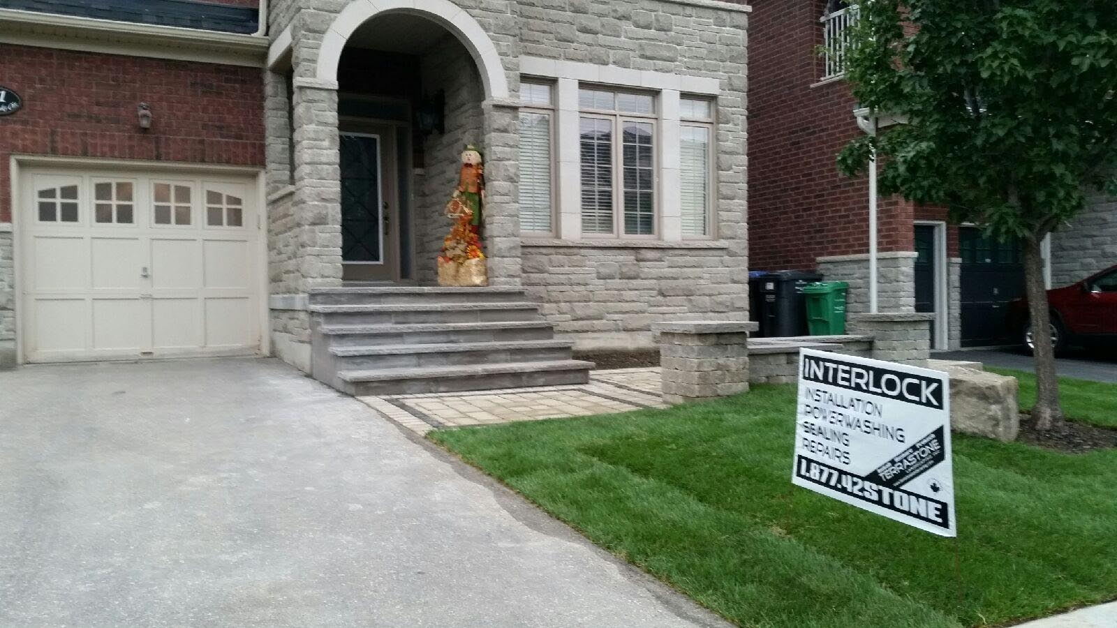 Landscaping Toronto - A Terrastone Landscaping sign displayed in front of a house.